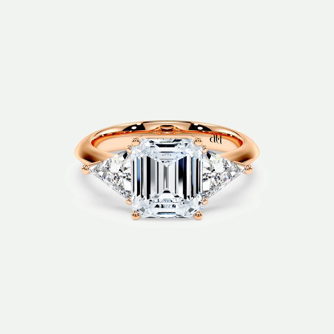 PRISM – 4 Claw Trilogy with Trillion Side Stones on a Plain Band